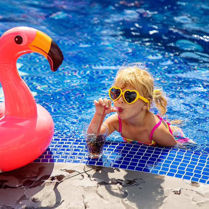 Family enjoying algae-free pool maintained by Affordable Pool Care weekly pool service with green pool guarantee